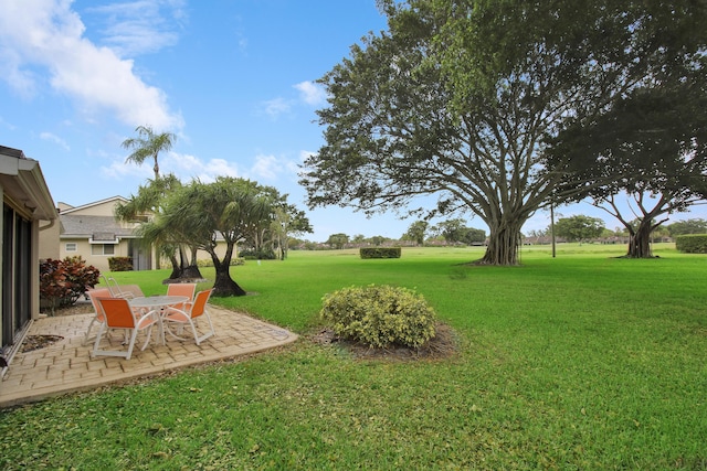 6907 Fountains Cir, Lake Worth, FL 33467 - view of grassy yard featuring a patio