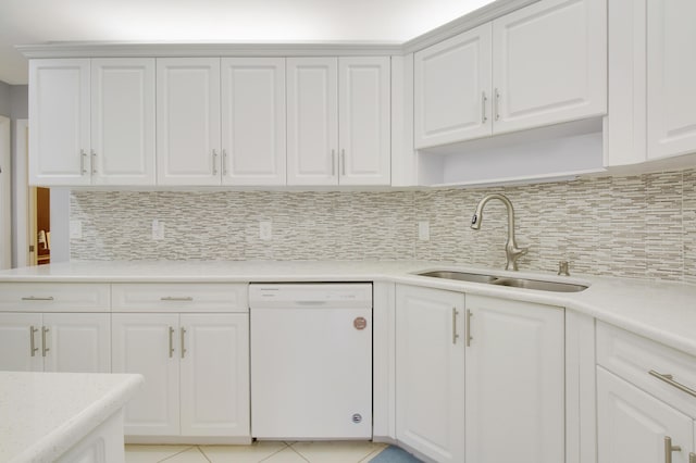 6907 Fountains Cir, Lake Worth, FL 33467 - kitchen with white dishwasher, a sink, tasteful backsplash, and light countertops