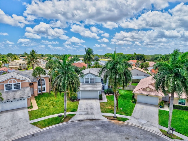 6290 Windchime Pl, Boynton Beach, FL 33472 - traditional-style home featuring driveway, a residential view, and a front lawn