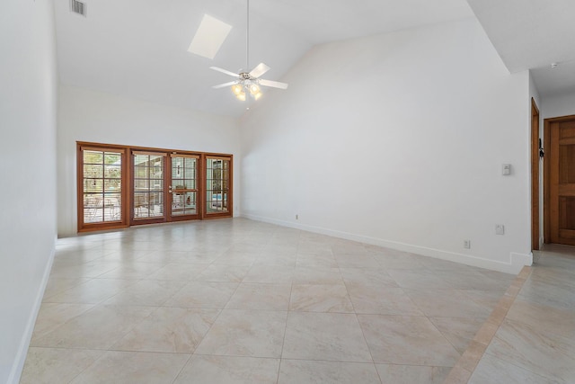 unfurnished room featuring ceiling fan, visible vents, light tile patterned floors, baseboards, and high vaulted ceiling
