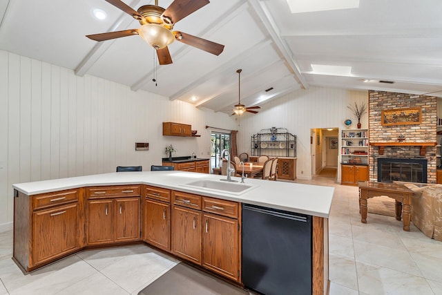 kitchen featuring lofted ceiling with beams, a sink, dishwasher, a ceiling fan, and open floor plan