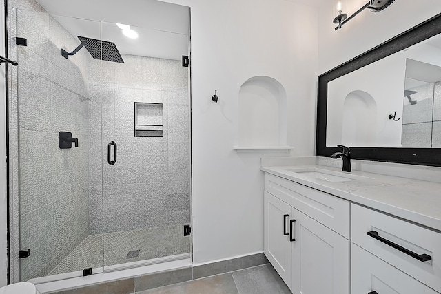 725 N Ocean Breeze, Lake Worth Beach, FL 33460 - bathroom featuring vanity, a shower stall, tile patterned flooring, and baseboards