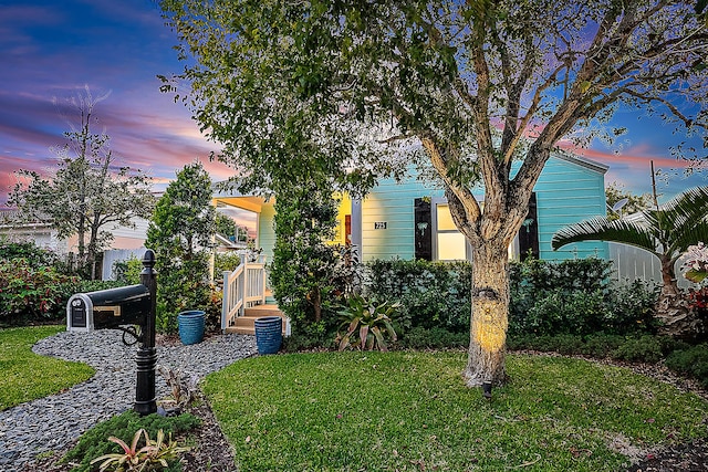725 N Ocean Breeze, Lake Worth Beach, FL 33460 - view of property hidden behind natural elements featuring a front lawn