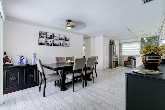 1050 Singer Dr, Singer Island, FL 33404 - dining room with visible vents, light wood finished floors, and ceiling fan