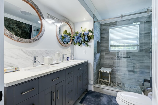 1050 Singer Dr, Singer Island, FL 33404 - bathroom featuring toilet, a sink, double vanity, and a stall shower