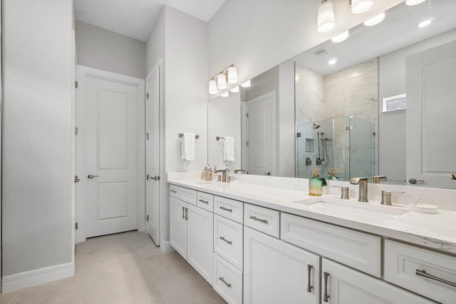 full bathroom featuring double vanity, visible vents, a stall shower, a sink, and tile patterned floors