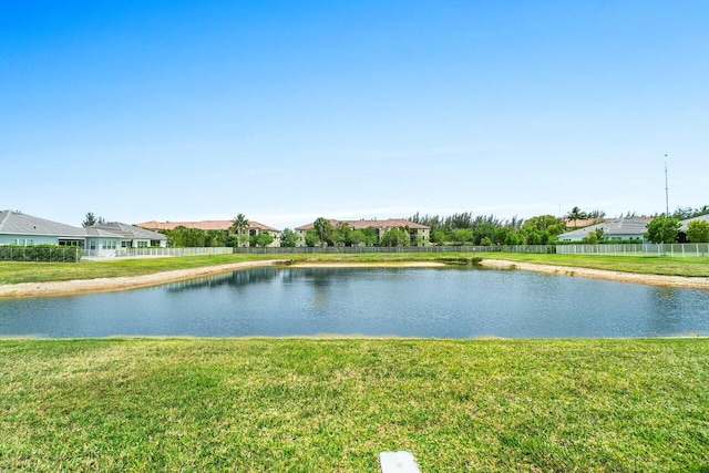 property view of water featuring fence