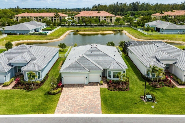 birds eye view of property with a residential view and a water view