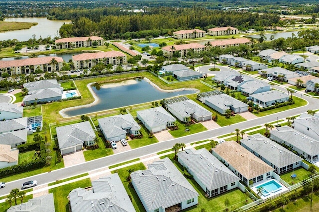 bird's eye view with a water view and a residential view