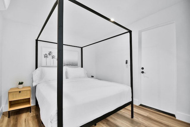 bedroom with wood finished floors