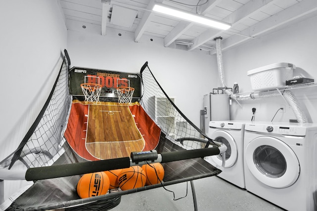 washroom featuring laundry area and washing machine and dryer