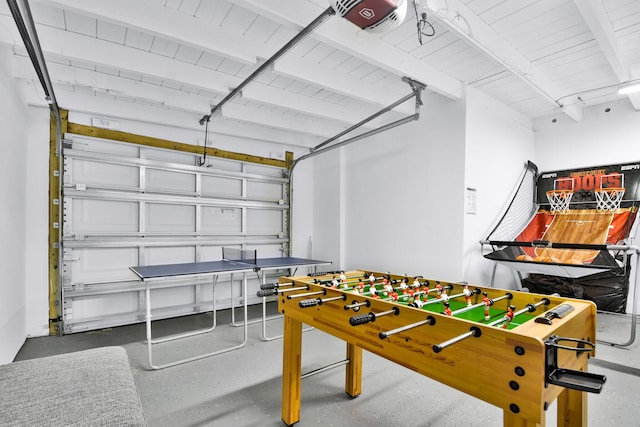 rec room with wood ceiling, beamed ceiling, and a garage