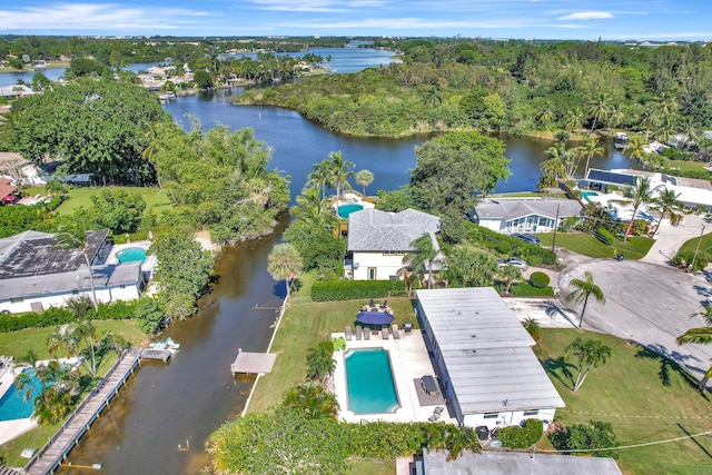 drone / aerial view with a water view and a residential view