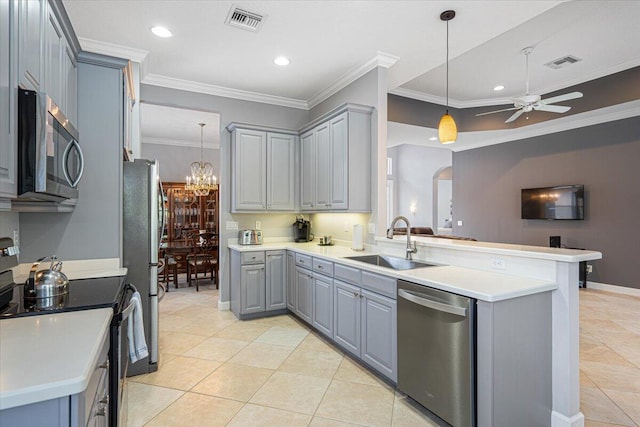 kitchen with gray cabinetry, a sink, appliances with stainless steel finishes, and visible vents