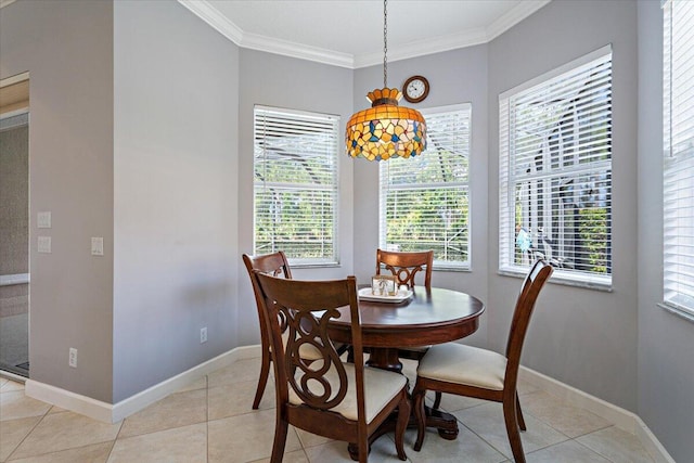 dining area with ornamental molding, light tile patterned floors, and baseboards