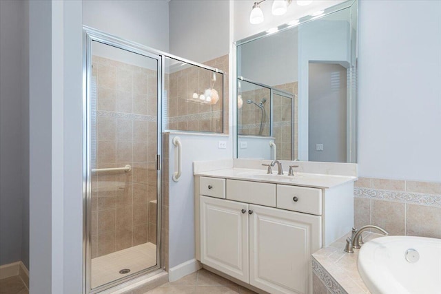 full bath with a garden tub, a stall shower, tile patterned flooring, and vanity