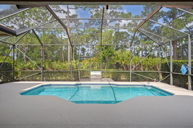 pool with a patio and a lanai