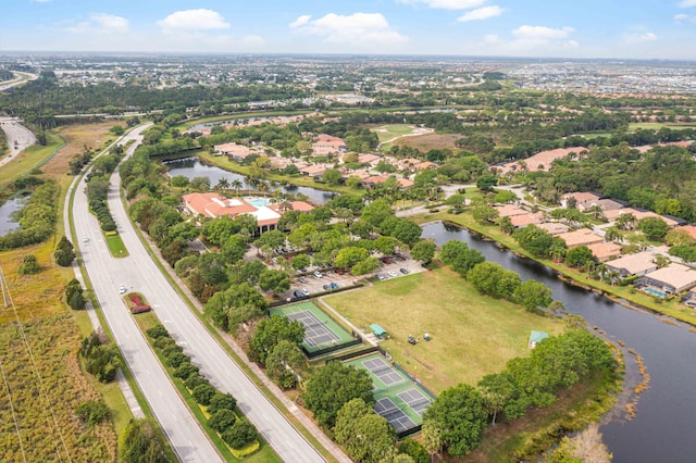 drone / aerial view with a residential view and a water view