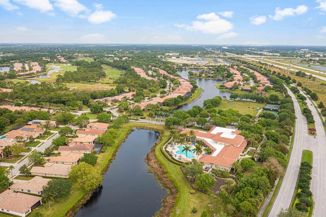 birds eye view of property with a water view and a residential view