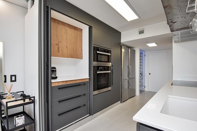 4101 N Ocean Blvd Unit 504, Boca Raton, FL 33431 - kitchen featuring a sink, high end refrigerator, gray cabinets, visible vents, and light countertops
