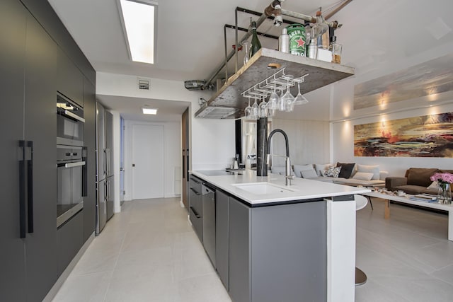 4101 N Ocean Blvd Unit 504, Boca Raton, FL 33431 - kitchen featuring a sink, modern cabinets, stainless steel appliances, visible vents, and open floor plan