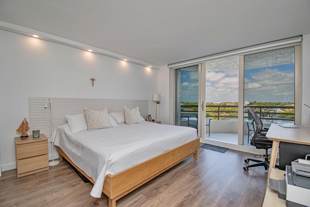 4101 N Ocean Blvd Unit 504, Boca Raton, FL 33431 - bedroom with access to outside, light wood finished floors, and floor to ceiling windows