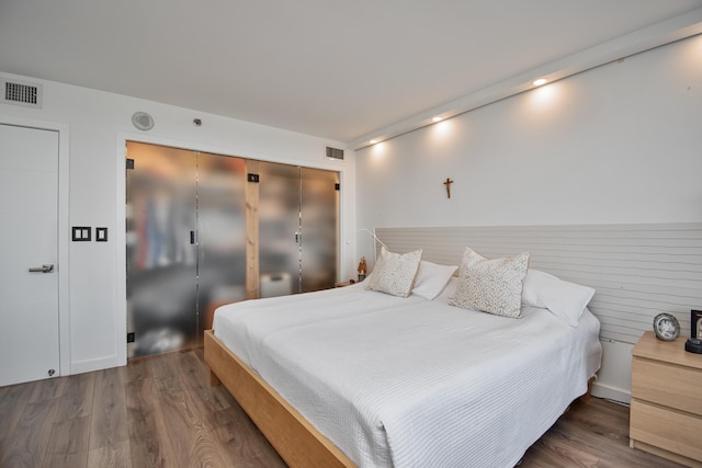 4101 N Ocean Blvd Unit 504, Boca Raton, FL 33431 - bedroom with visible vents and wood finished floors