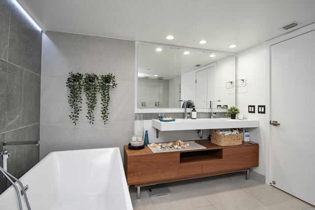 4101 N Ocean Blvd Unit 504, Boca Raton, FL 33431 - bathroom with recessed lighting, vanity, tile patterned floors, visible vents, and a soaking tub