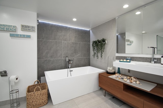 4101 N Ocean Blvd Unit 504, Boca Raton, FL 33431 - full bathroom with tile walls, recessed lighting, a soaking tub, and vanity
