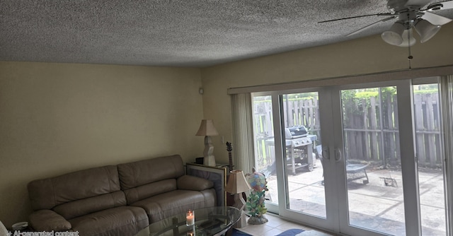 102 Weybridge Cir Unit D, Royal Palm Beach, FL 33411 - living area featuring ceiling fan, a textured ceiling, and tile patterned flooring