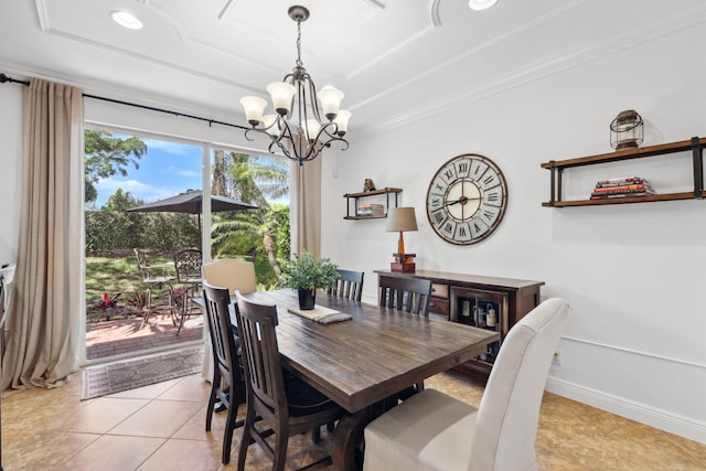 dining space featuring an inviting chandelier, ornamental molding, baseboards, a raised ceiling, and light tile patterned floors