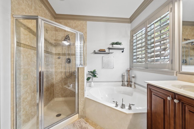 bathroom featuring vanity, ornamental molding, a shower stall, and a garden tub