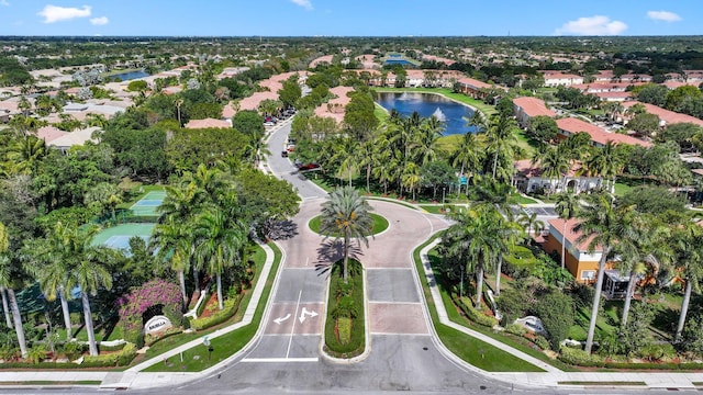 bird's eye view featuring a water view and a residential view