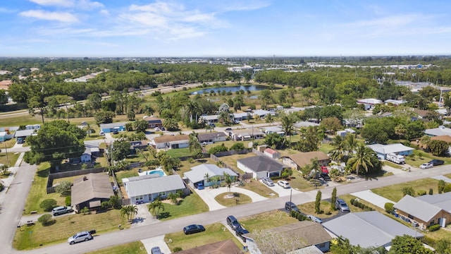 bird's eye view featuring a water view and a residential view