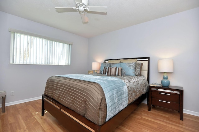 1432 S Lakeside Dr Unit 11, Lake Worth Beach, FL 33460 - bedroom featuring baseboards, ceiling fan, and wood finished floors