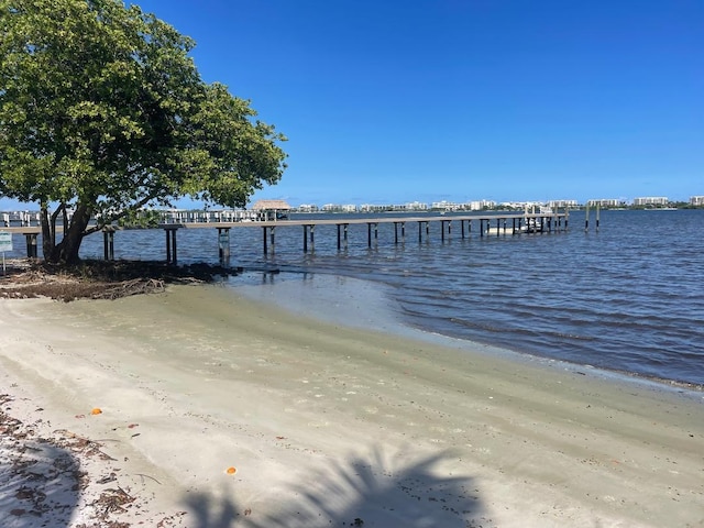 1432 S Lakeside Dr Unit 11, Lake Worth Beach, FL 33460 - dock area featuring a beach view and a water view