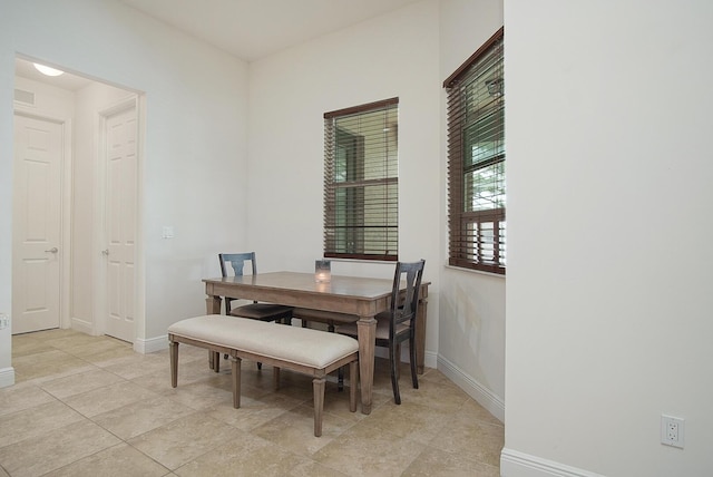 dining room featuring visible vents and baseboards