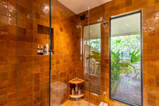 full bathroom featuring tiled shower