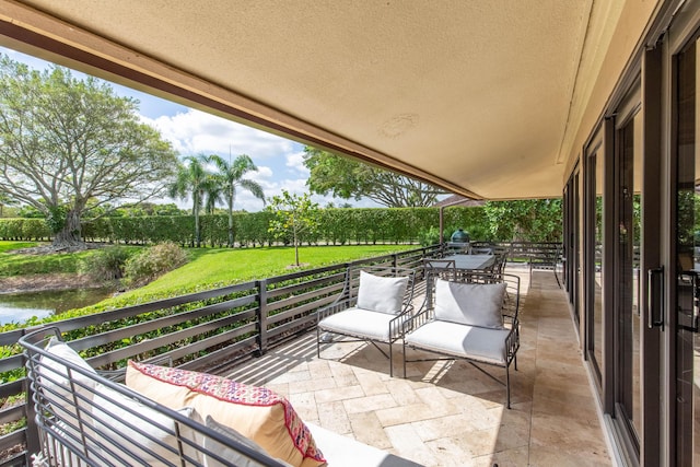 balcony featuring a water view