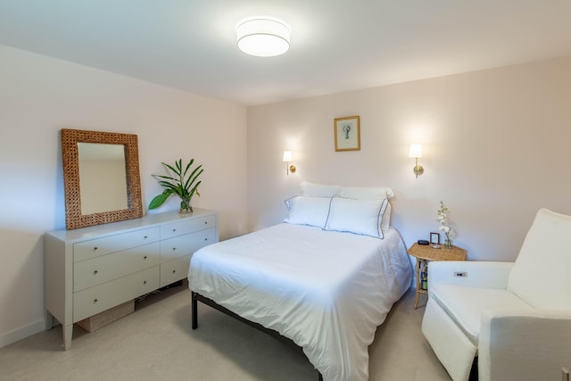 bedroom featuring light carpet