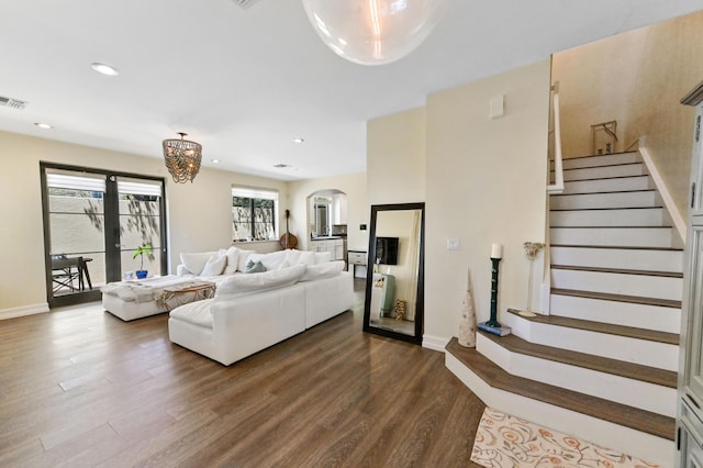 210 Via Villagio, Hypoluxo, FL 33462 - living area featuring arched walkways, stairs, baseboards, dark wood-style floors, and recessed lighting