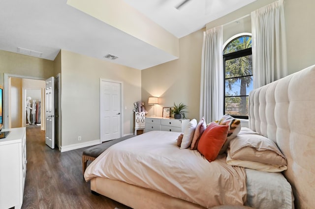 210 Via Villagio, Hypoluxo, FL 33462 - bedroom with visible vents, baseboards, and dark wood-style floors