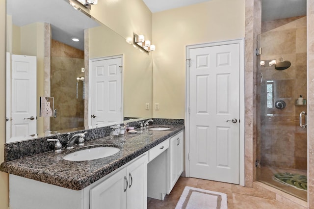 210 Via Villagio, Hypoluxo, FL 33462 - full bathroom featuring a sink, tile patterned floors, a shower stall, and double vanity
