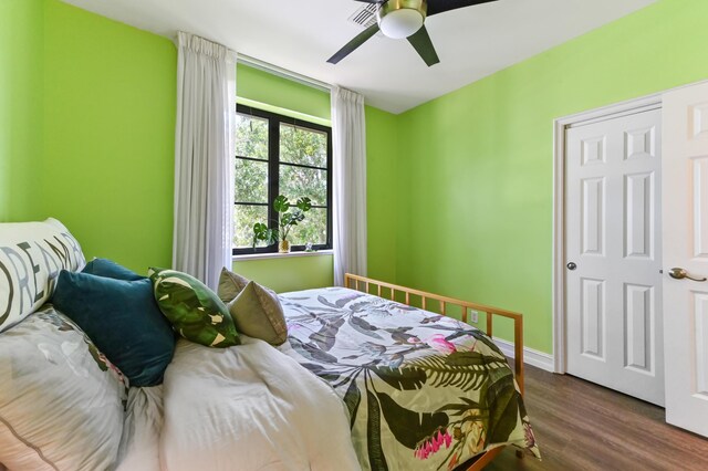 210 Via Villagio, Hypoluxo, FL 33462 - bedroom featuring visible vents, a ceiling fan, baseboards, and dark wood-style floors