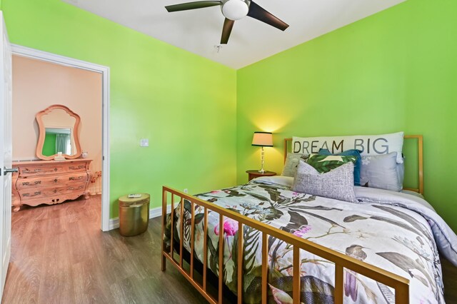 210 Via Villagio, Hypoluxo, FL 33462 - bedroom with baseboards, ceiling fan, and wood finished floors