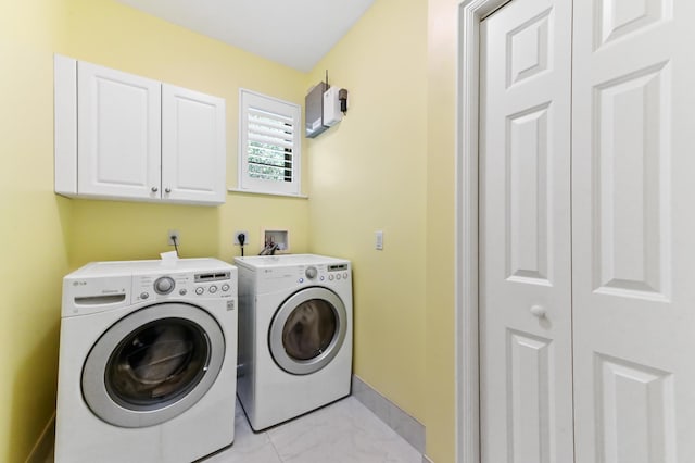 210 Via Villagio, Hypoluxo, FL 33462 - laundry area with cabinet space, independent washer and dryer, baseboards, and marble finish floor
