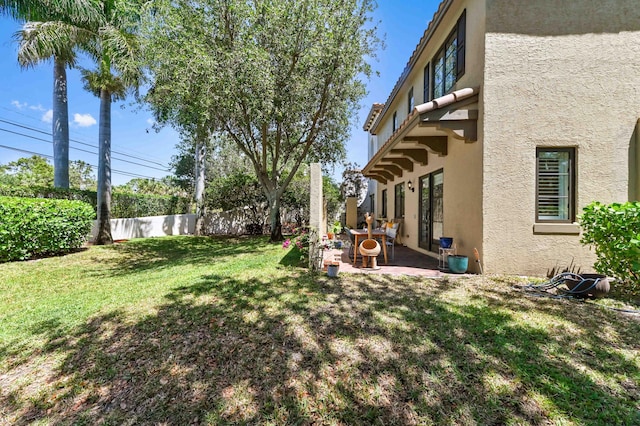 210 Via Villagio, Hypoluxo, FL 33462 - view of yard featuring a fenced backyard and a patio area