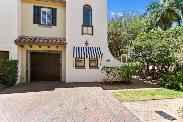 210 Via Villagio, Hypoluxo, FL 33462 - mediterranean / spanish-style home with decorative driveway, an attached garage, and stucco siding