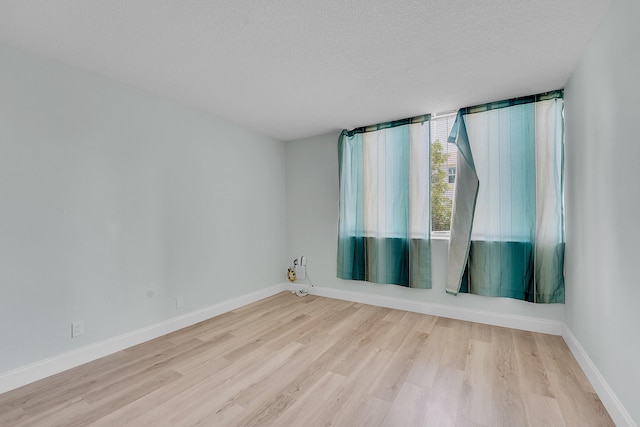 4345 Trevi Ct Unit 108, Lake Worth, FL 33467 - unfurnished room with wood finished floors and a textured ceiling