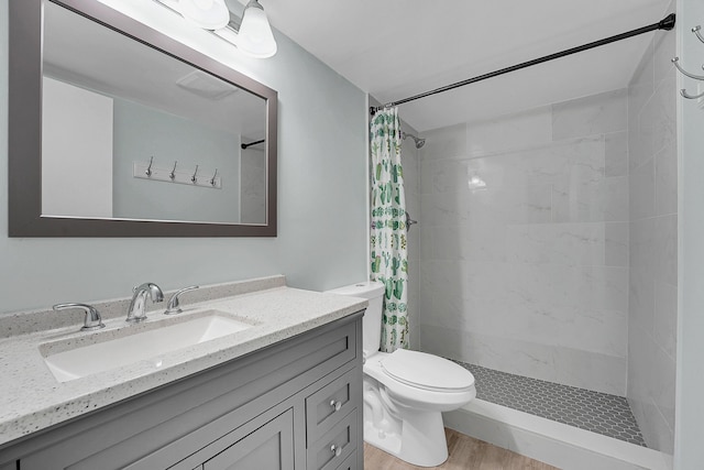 4345 Trevi Ct Unit 108, Lake Worth, FL 33467 - bathroom with vanity, tiled shower, and wood finished floors